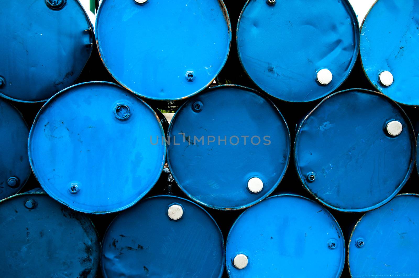 oil barrels or chemical drums stacked up by TanawatPontchour