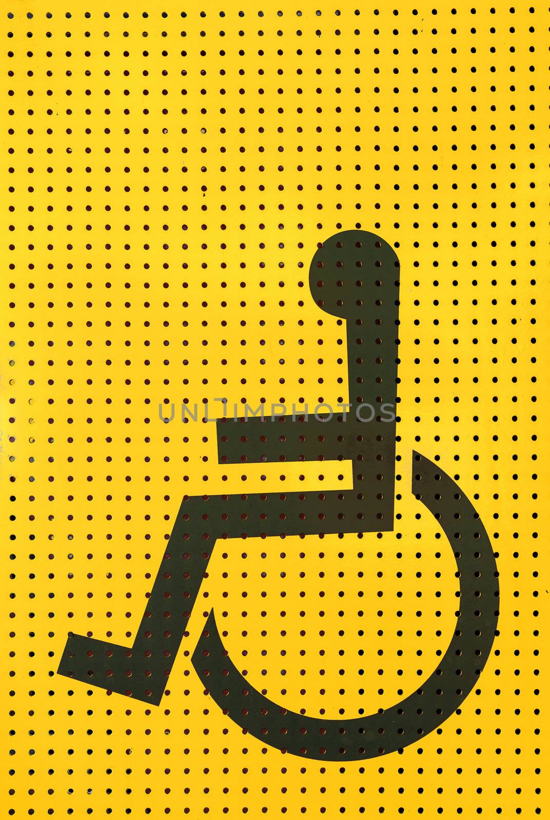sign disabled icon on yellow grating metal