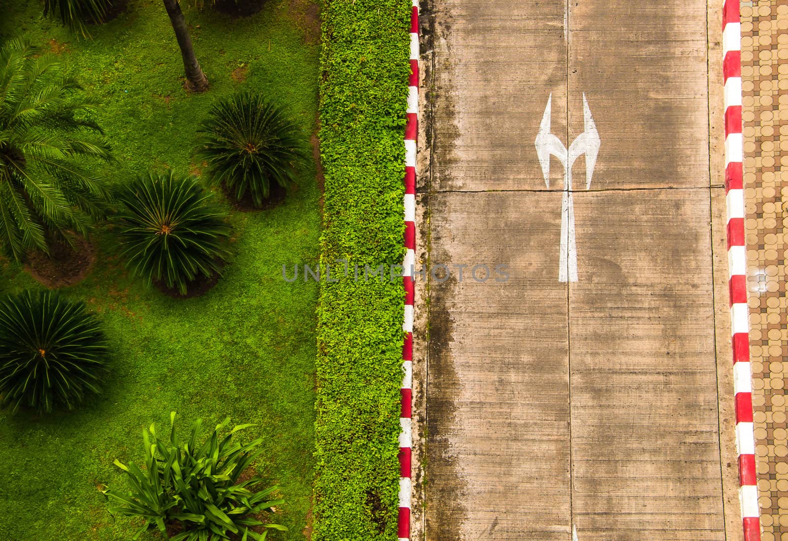 Top view shoot of concrete  street and garden