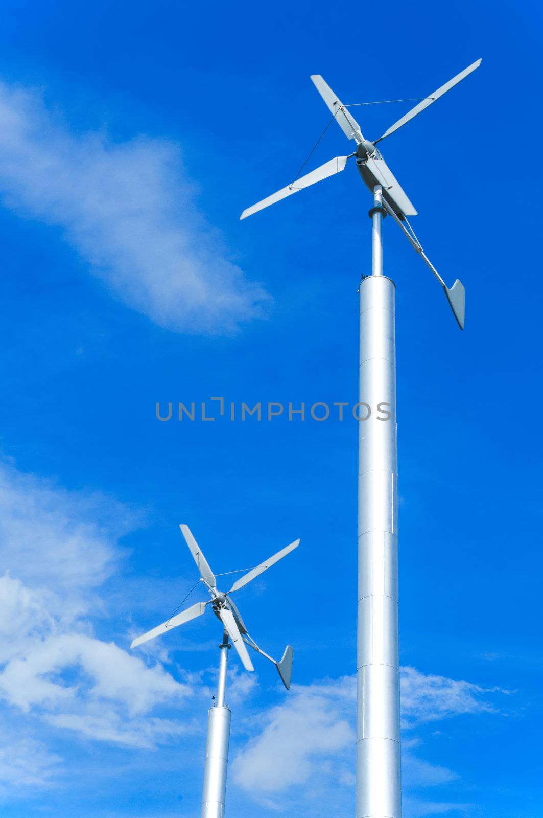 wind turbine on cloudy blue sky