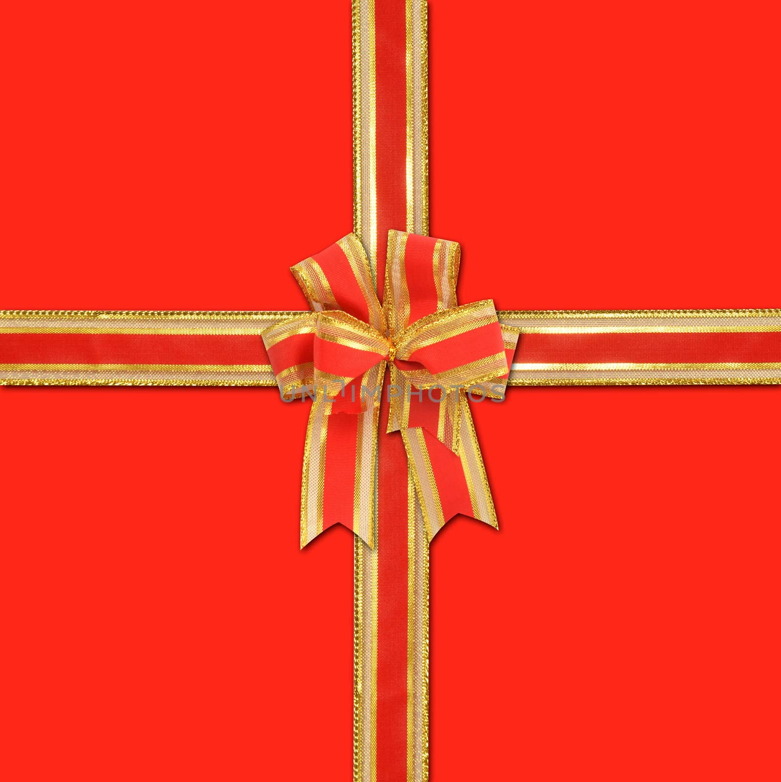 christmas gift with decorative red and gold ribbon bow