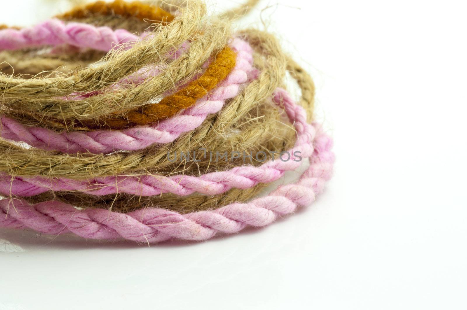 Whorl of hemp rope on white background