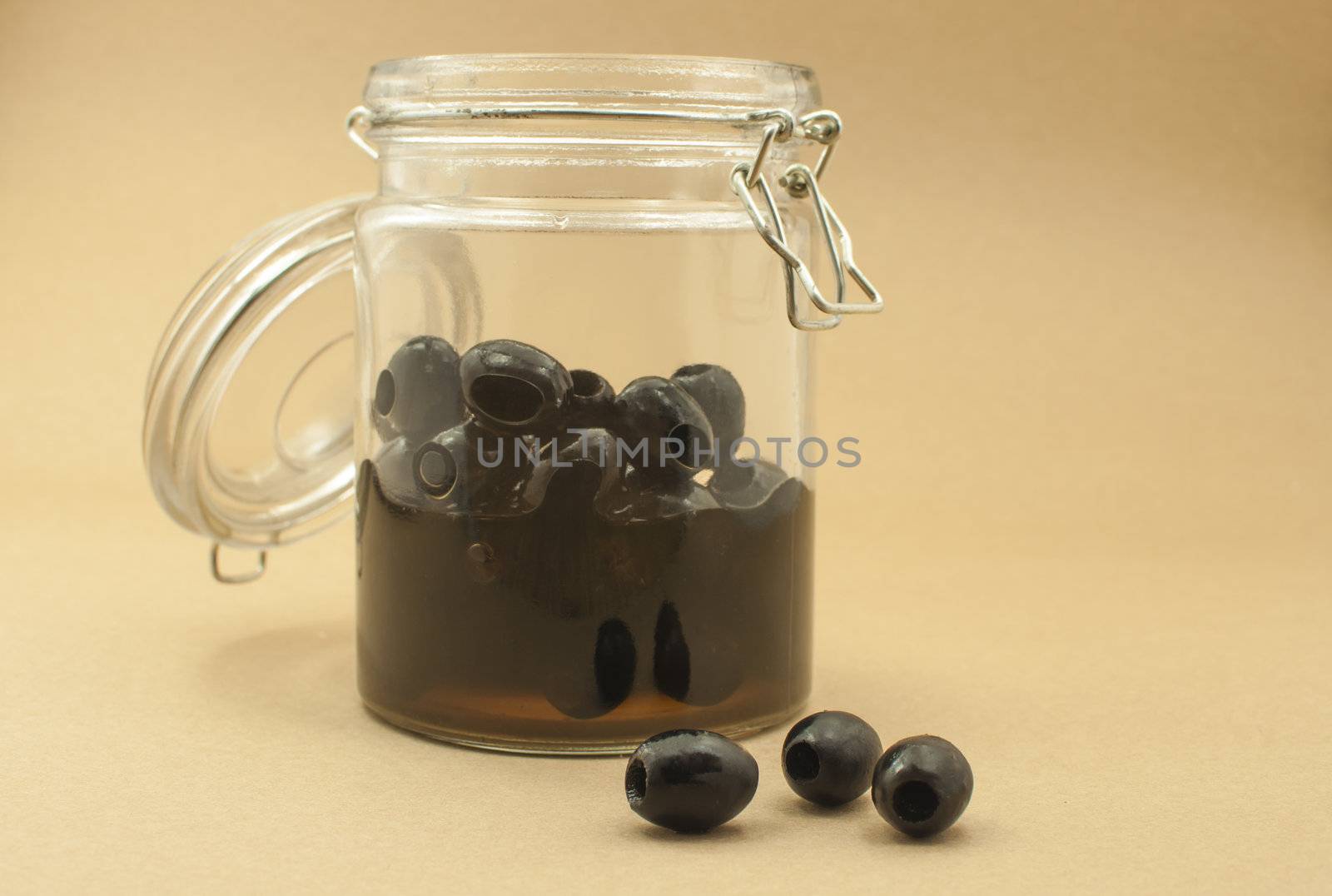 pickled black olives in glass bottle 