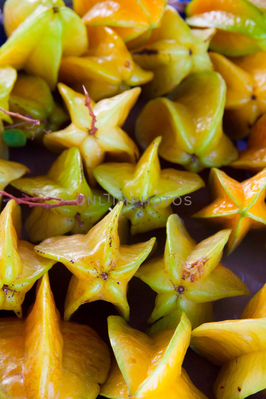 Hawaiian starfruit are stacked together at an organic market along the north shore of oahu hawaii.
