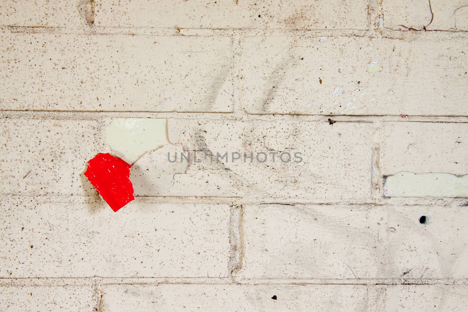 Details of a wall in very bad shape including discoloration and markings, great textured background images with copy space.