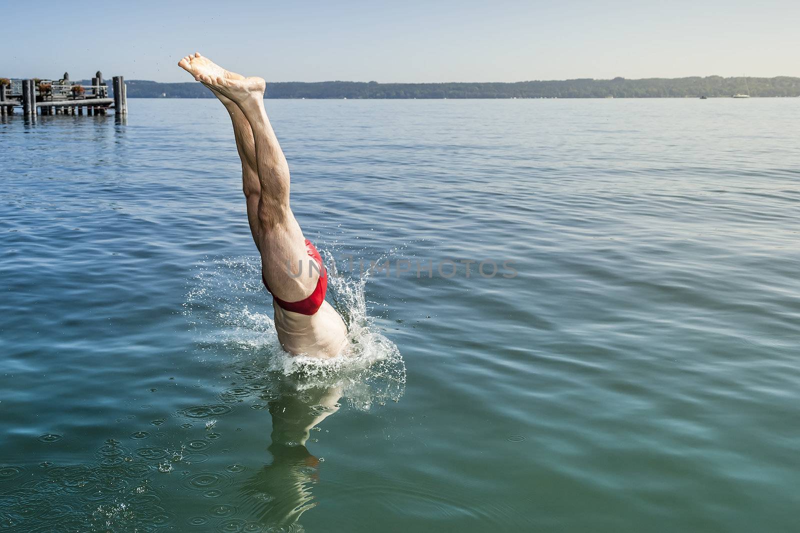 An image of a man jumping into the water