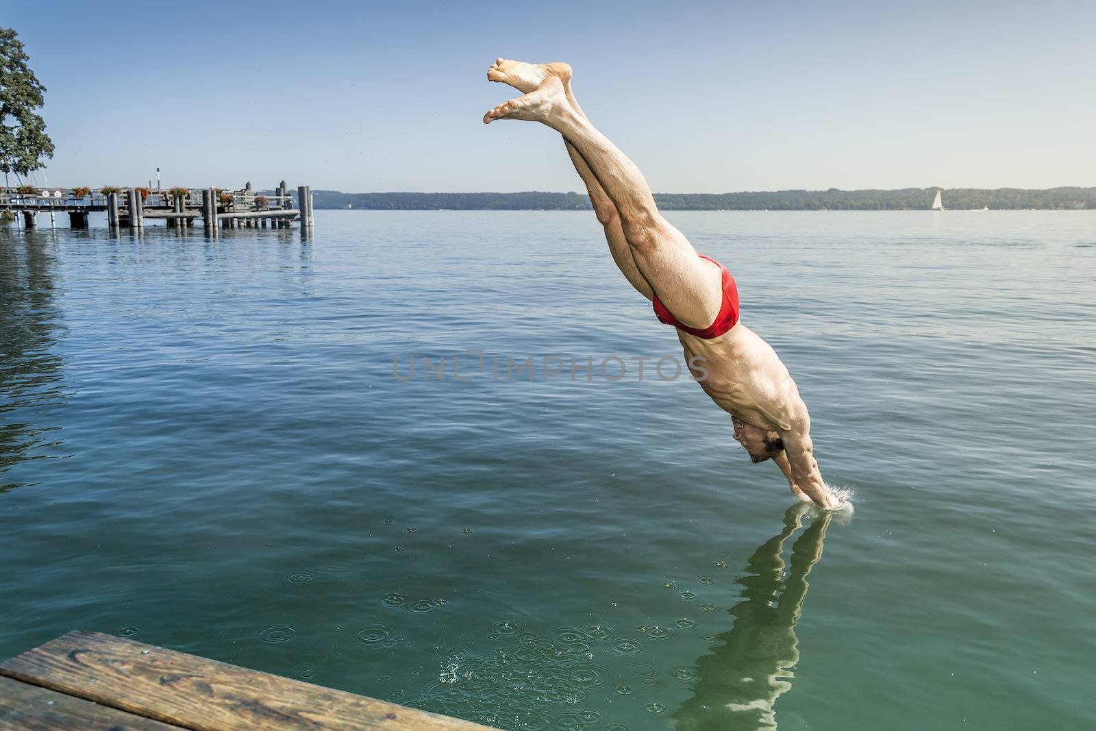 An image of a man jumping into the water