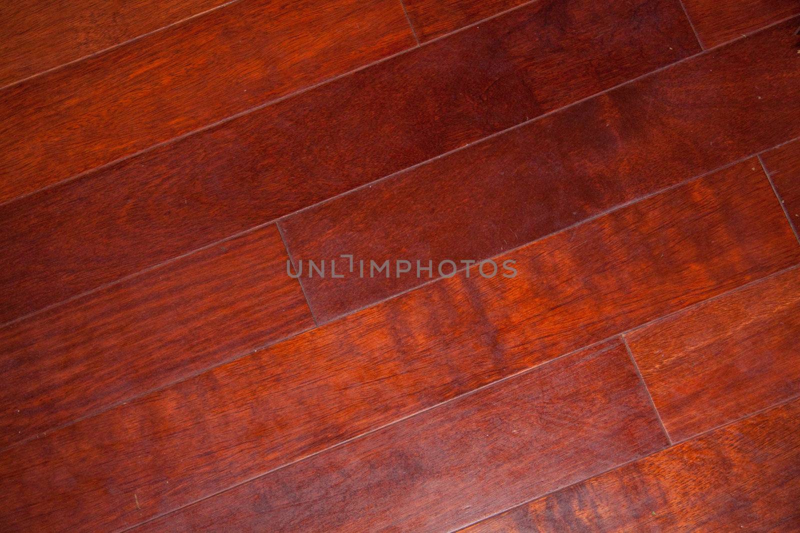 Cherry hard woods floors in a nice house that have been well kept for many years.