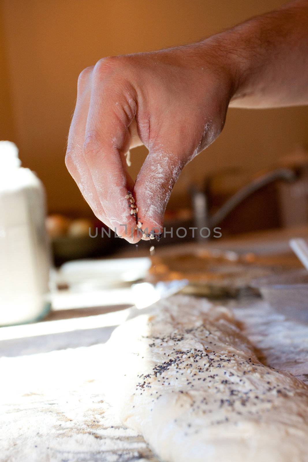 A baker prepares handmade artisan bread for baking.