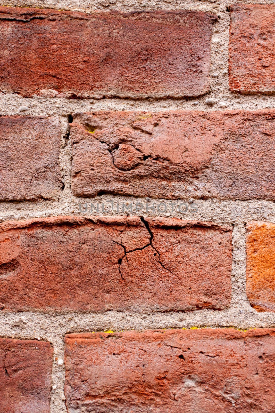 Old bricks are decaying and falling apart on this interesting textured background image.