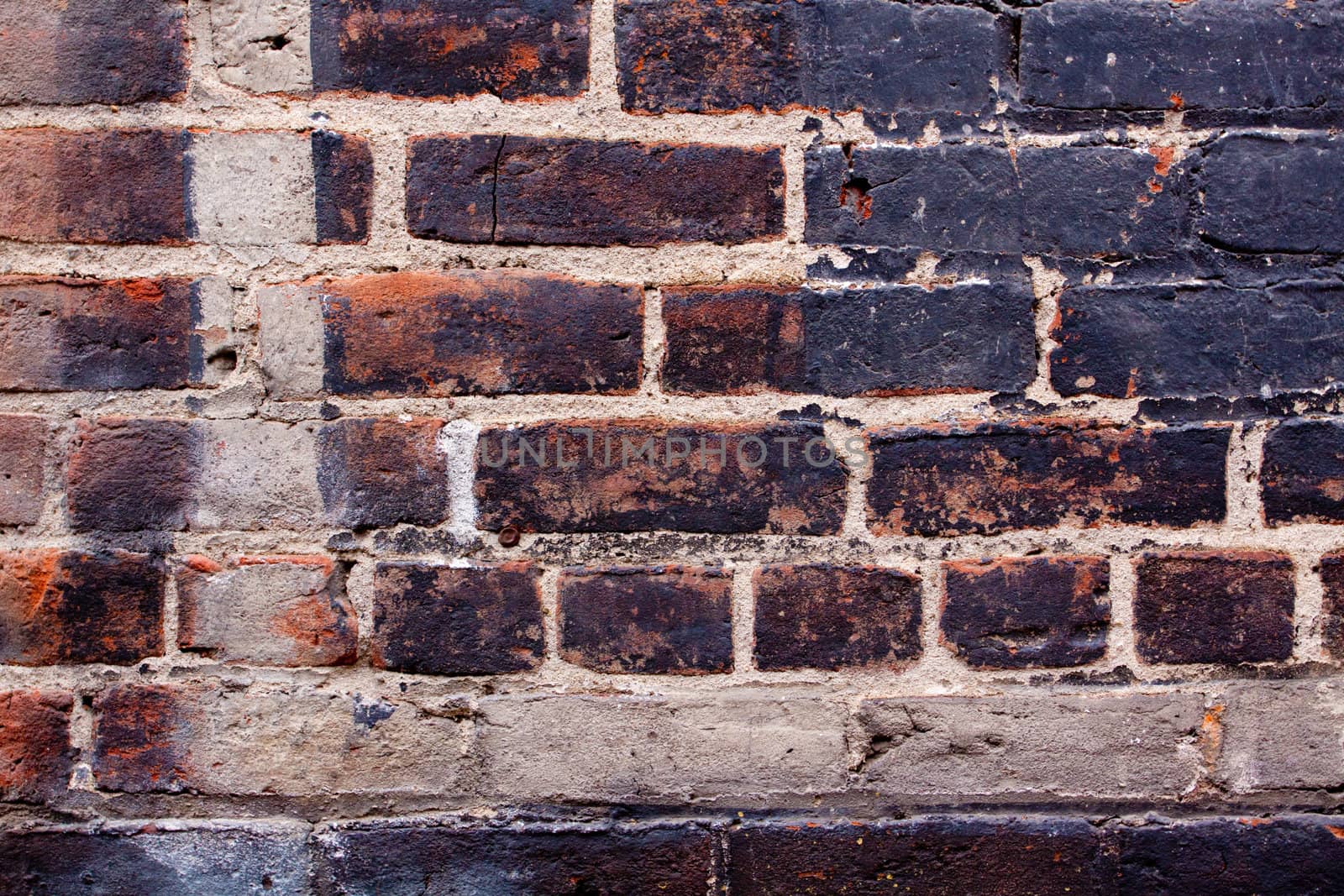 Old bricks are decaying and falling apart on this interesting textured background image.