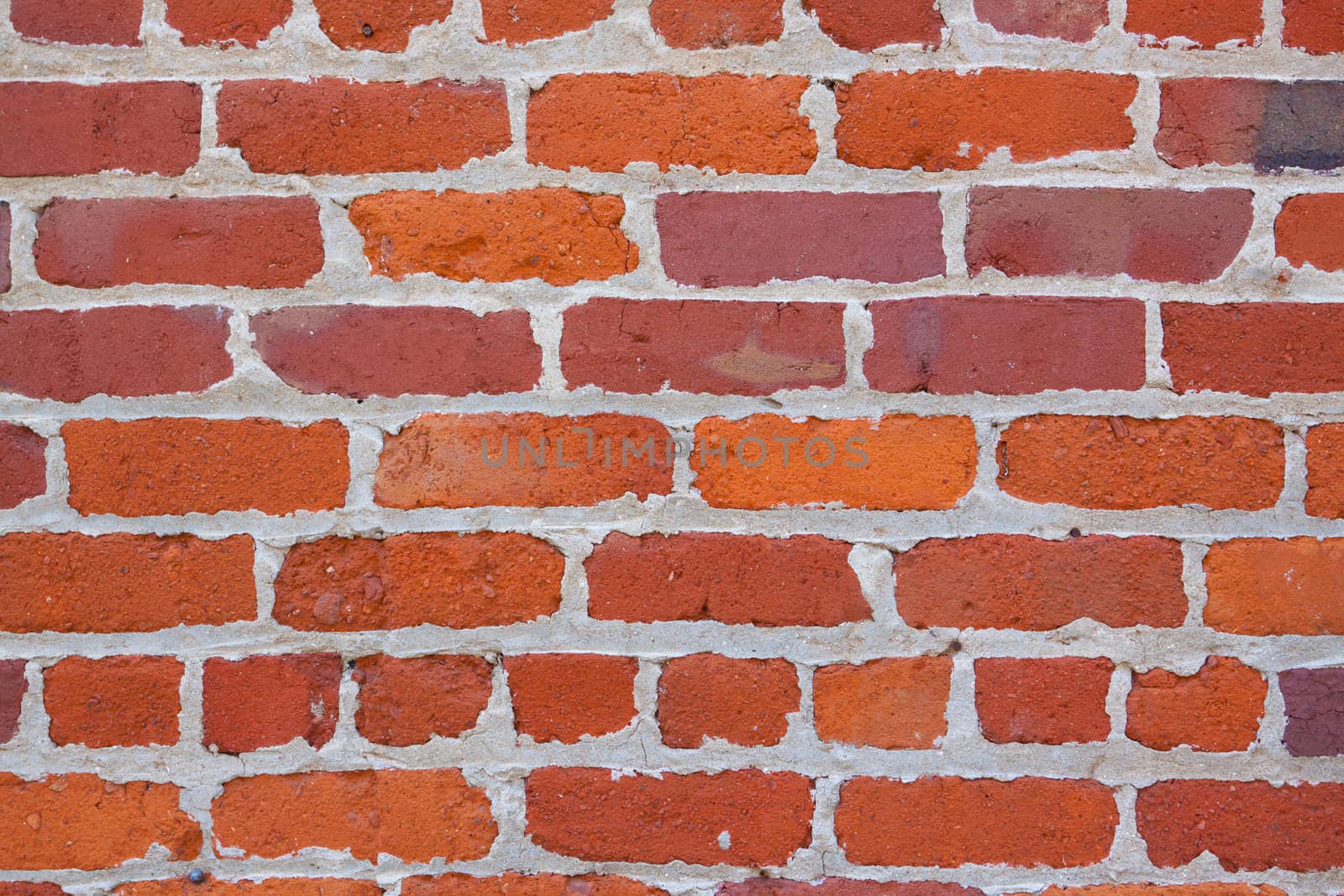 Abstract image of a red brick wall with mortar. Background texture photograph.