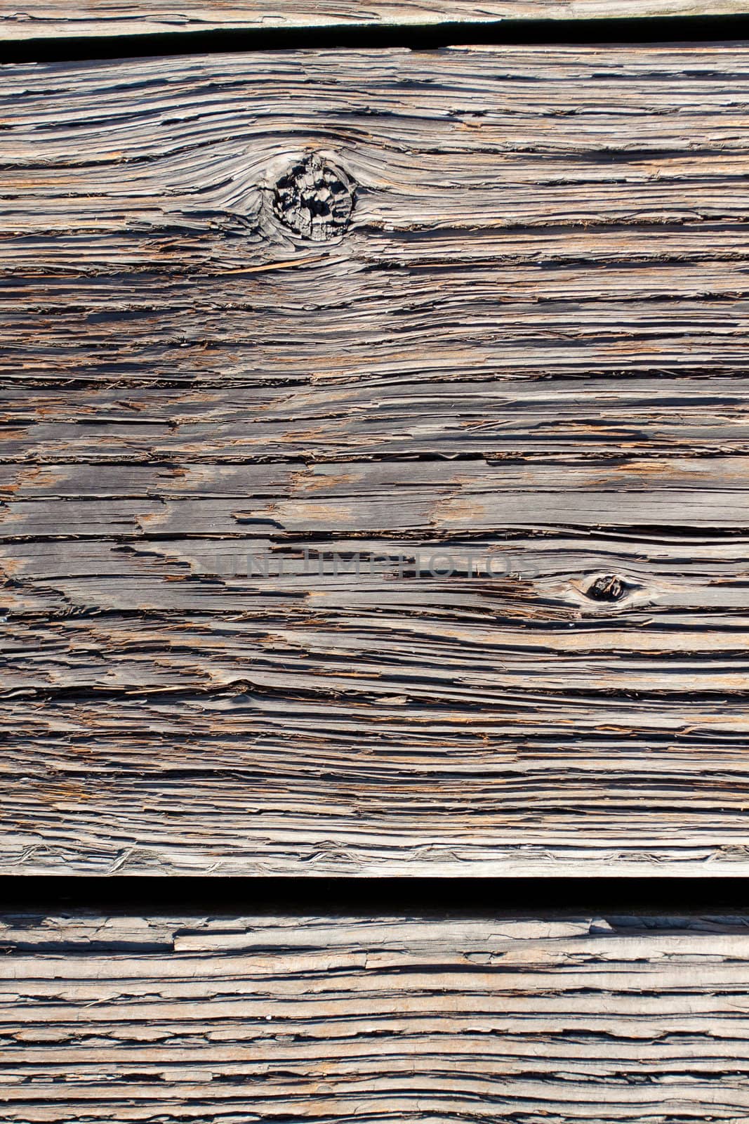 Wood boards are photographed at a dock to create some individual abstract images of the texture of wood after being weathered for many years.