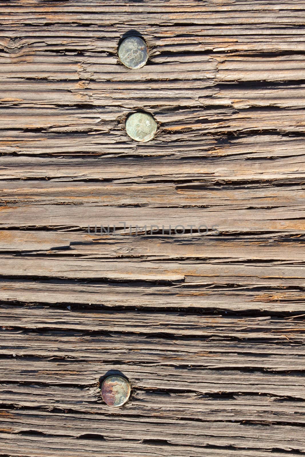 Wood boards are photographed at a dock to create some individual abstract images of the texture of wood after being weathered for many years.