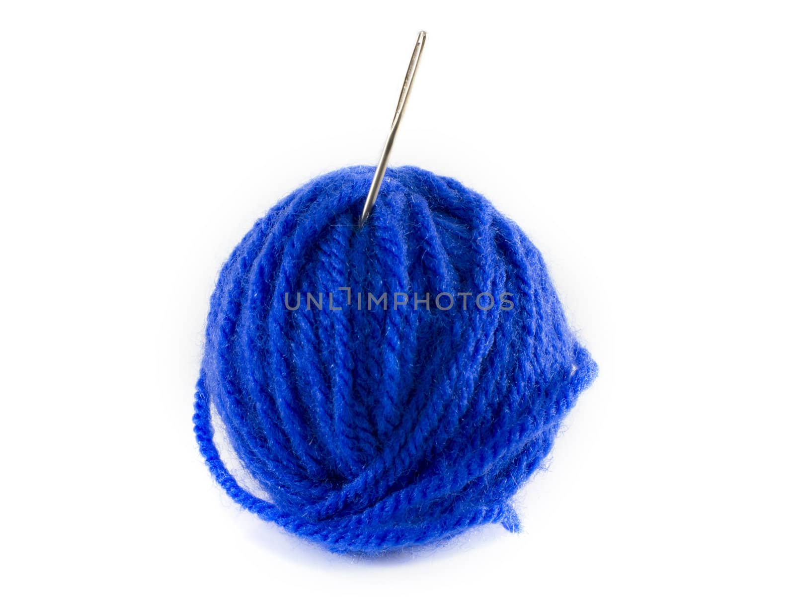 ball of blue wool and metal needle