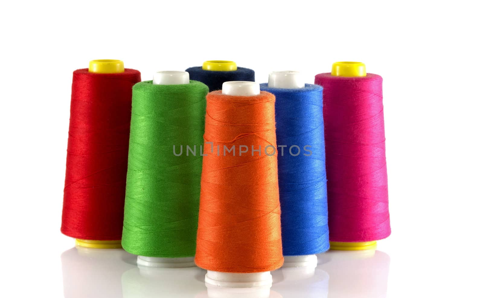 orange red blue green and pink bobbin isoalted on white