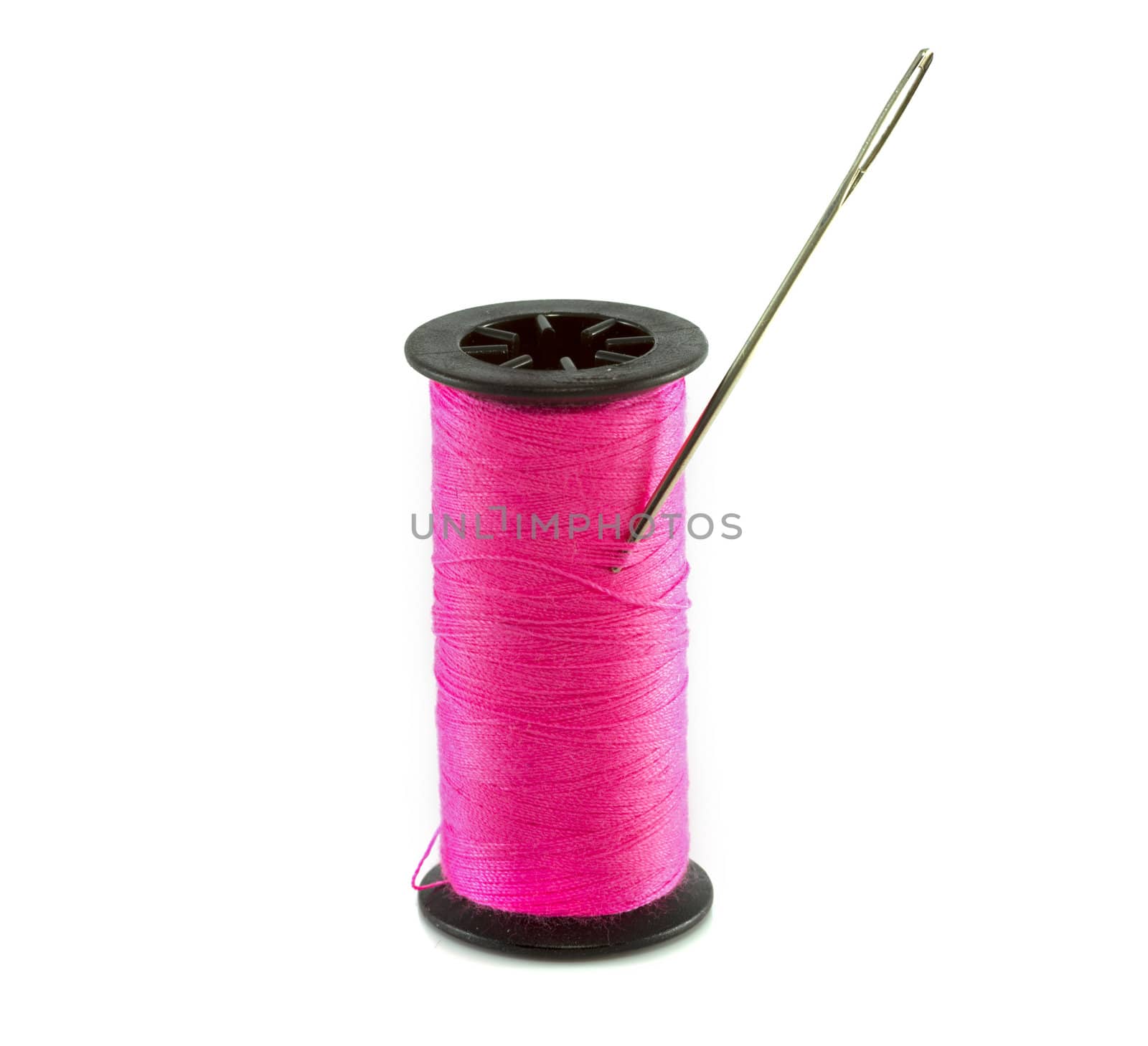 pink thread with needle isolated on white