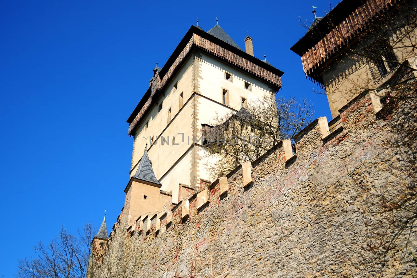 Part of Karlstejn Castle over blue sky during the summer day