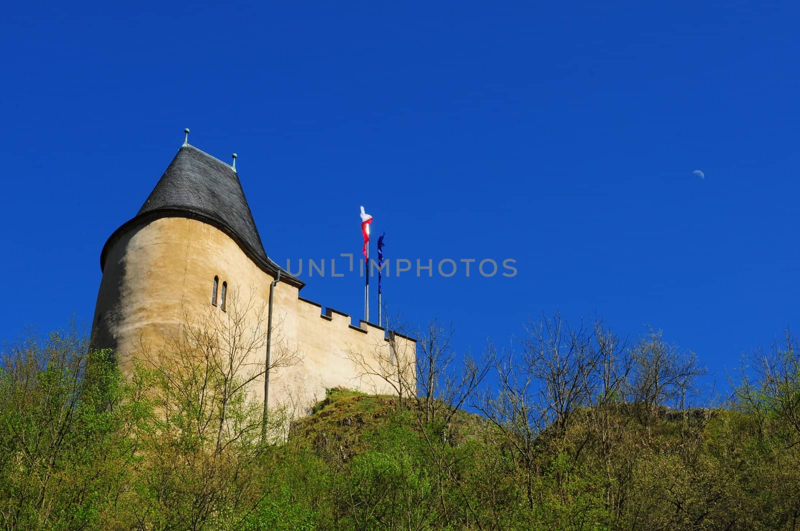 Part of Karlstejn Castle over blue sky during the summer day