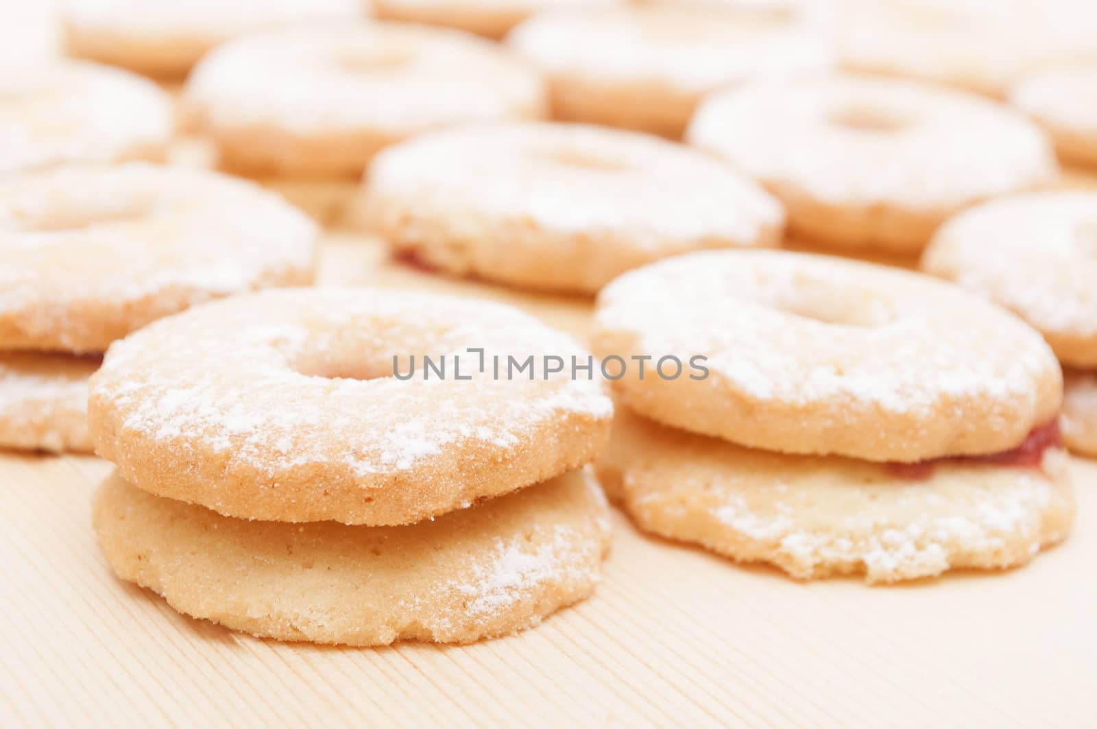 Closeup of Traditional Linzer Cookies on Wooden Board 