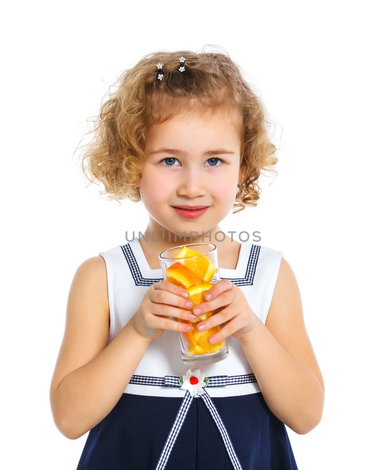 Portrait of happy little girl drinking orange juice. Isolated over white background.