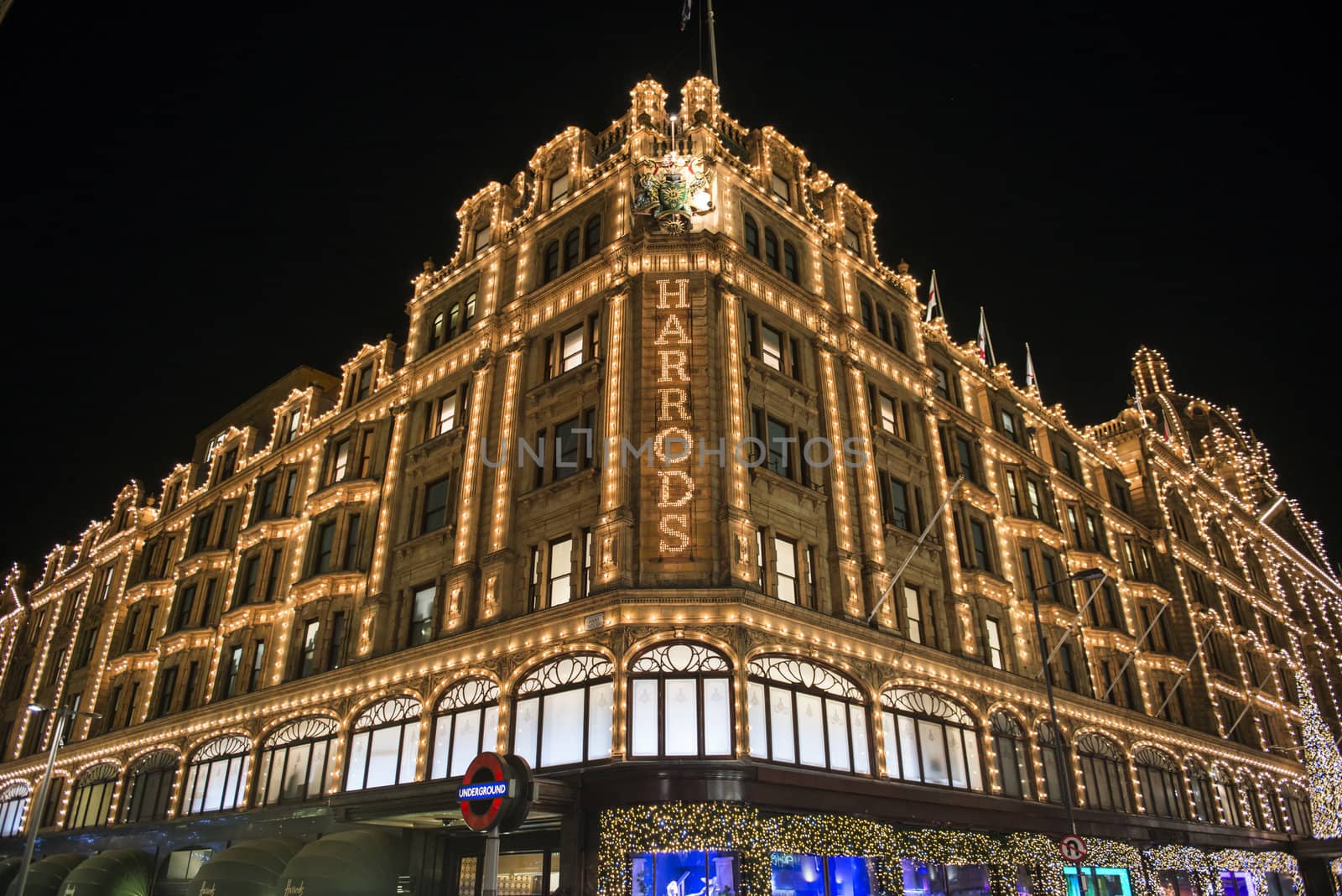 LONDON, UK - NOVEMBER 05: Corner of famous department store Harrods. Its Christmas lights have become a London tradition. November 05, 2012 in London.