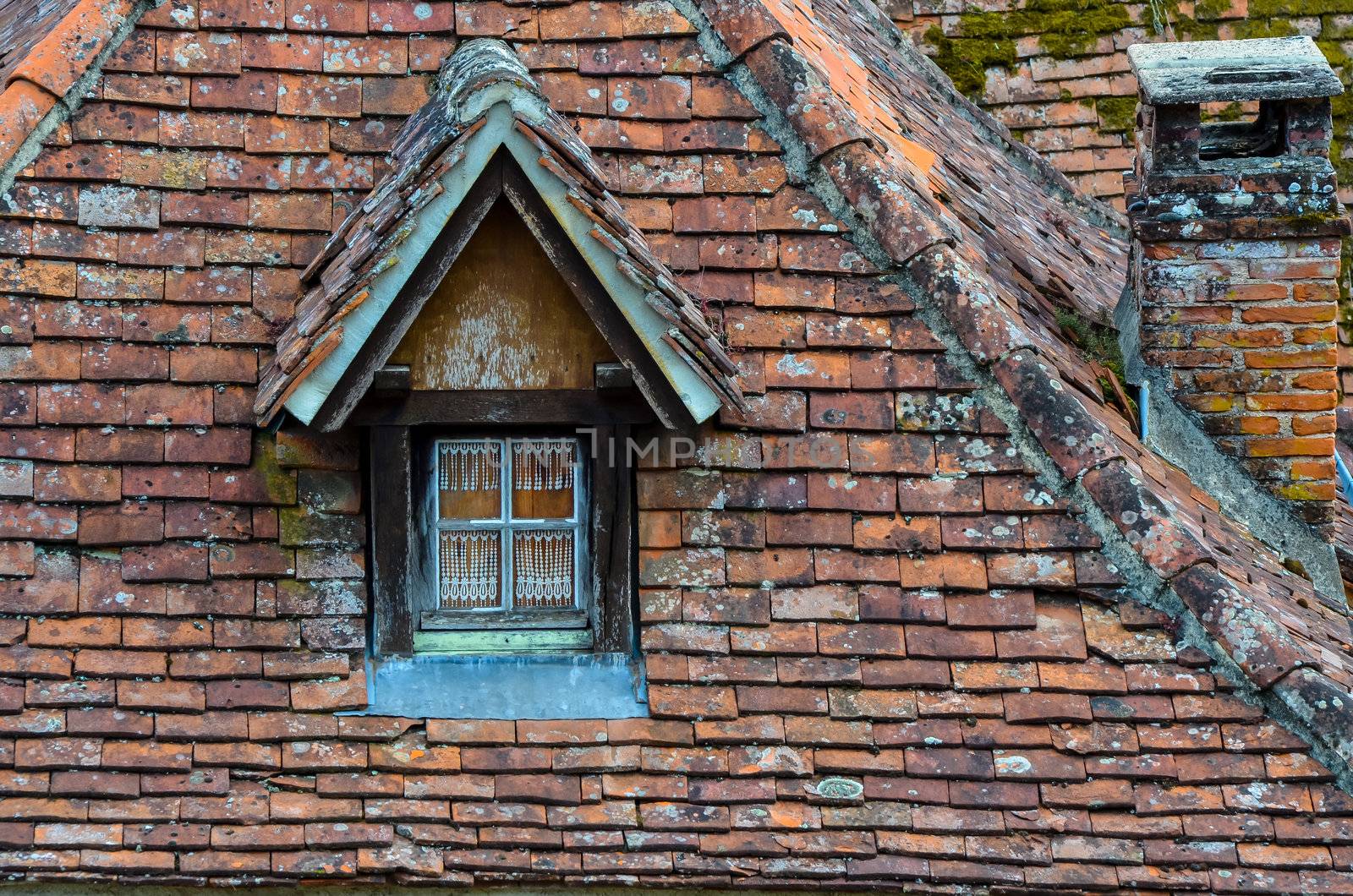 Old brick roof with window and a chimney by martinm303