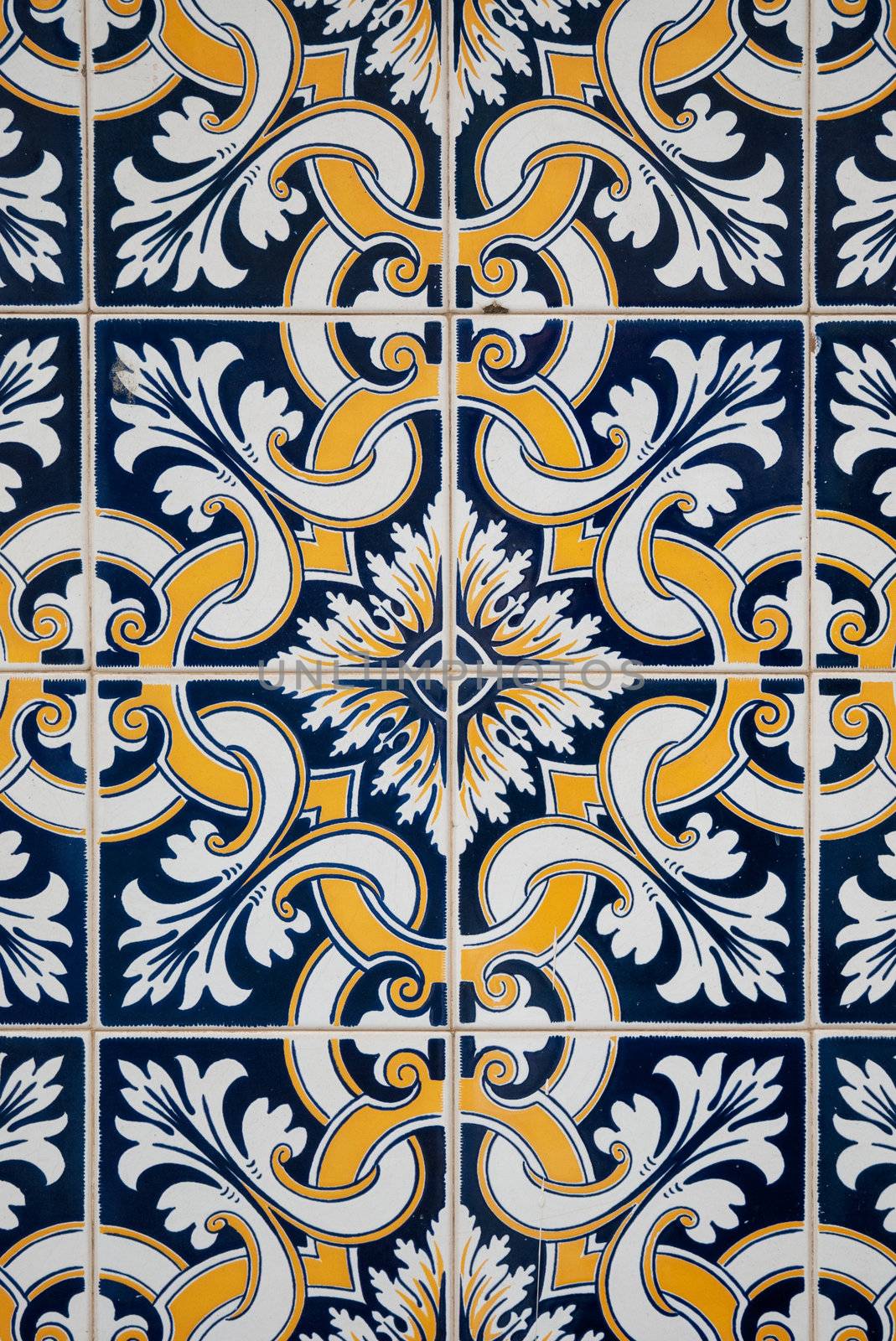 Traditional spanish ceramic tiles in yellow, white and blue