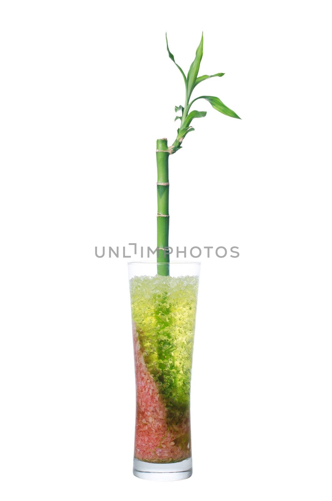 Glass jar with bamboo isolated on white background.
