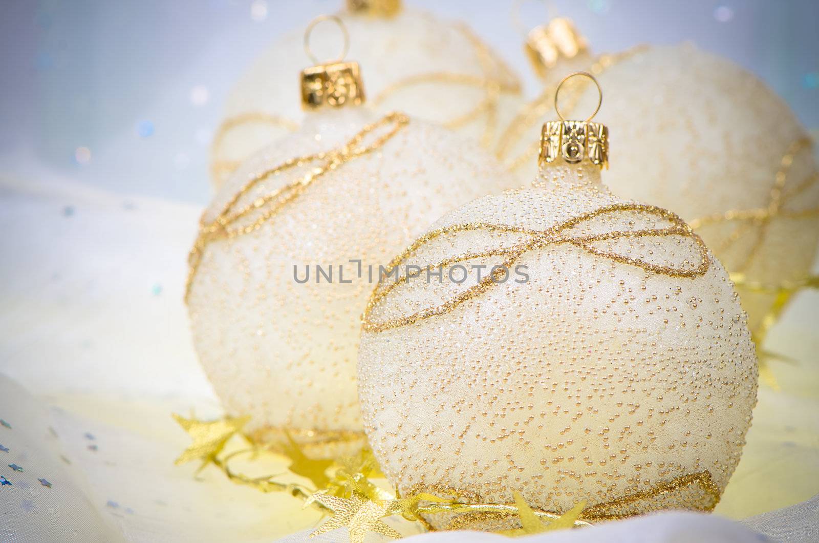 Christmas ball baubles with blue and gold decoration.
