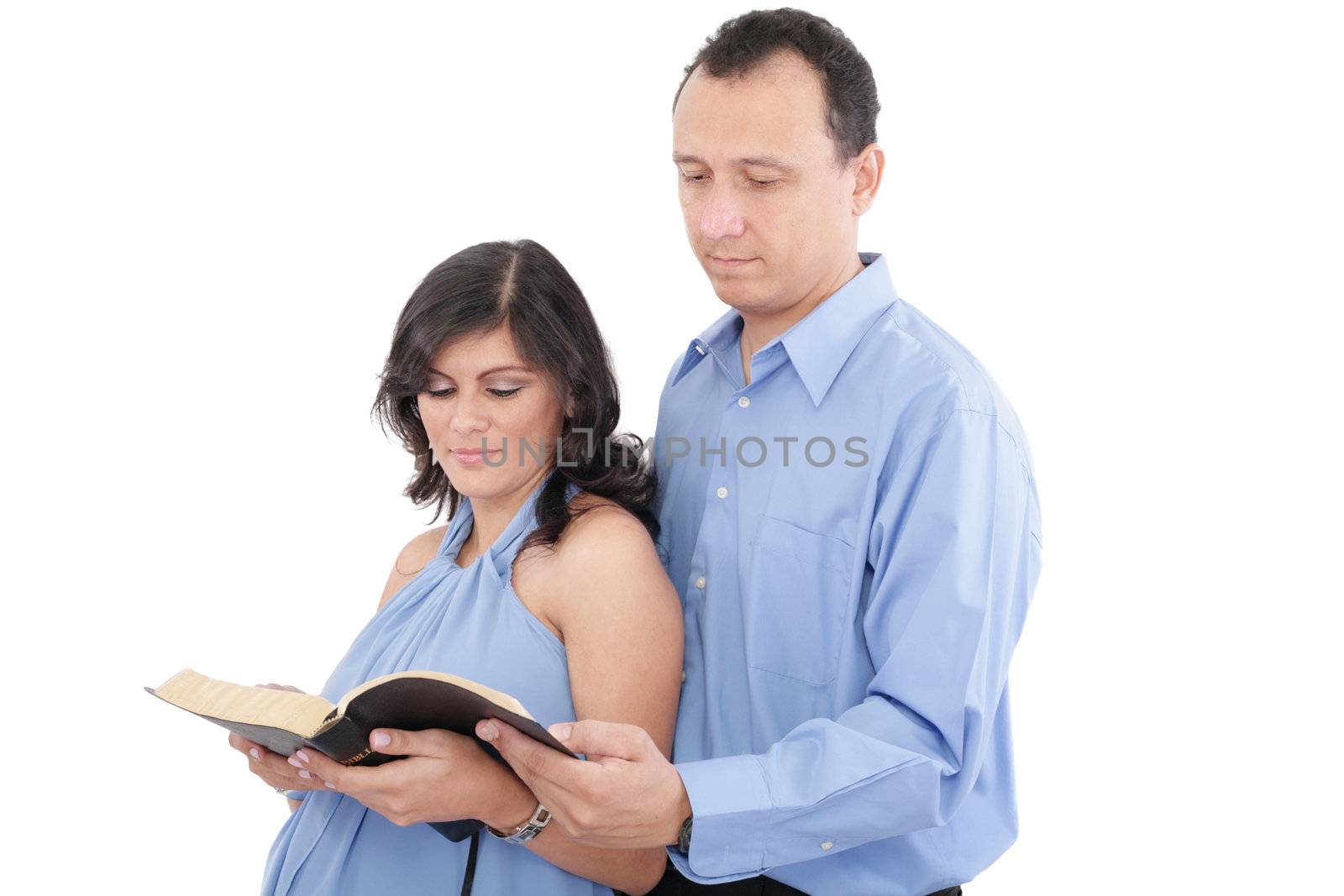 Attractive couple reading the Bible by dacasdo