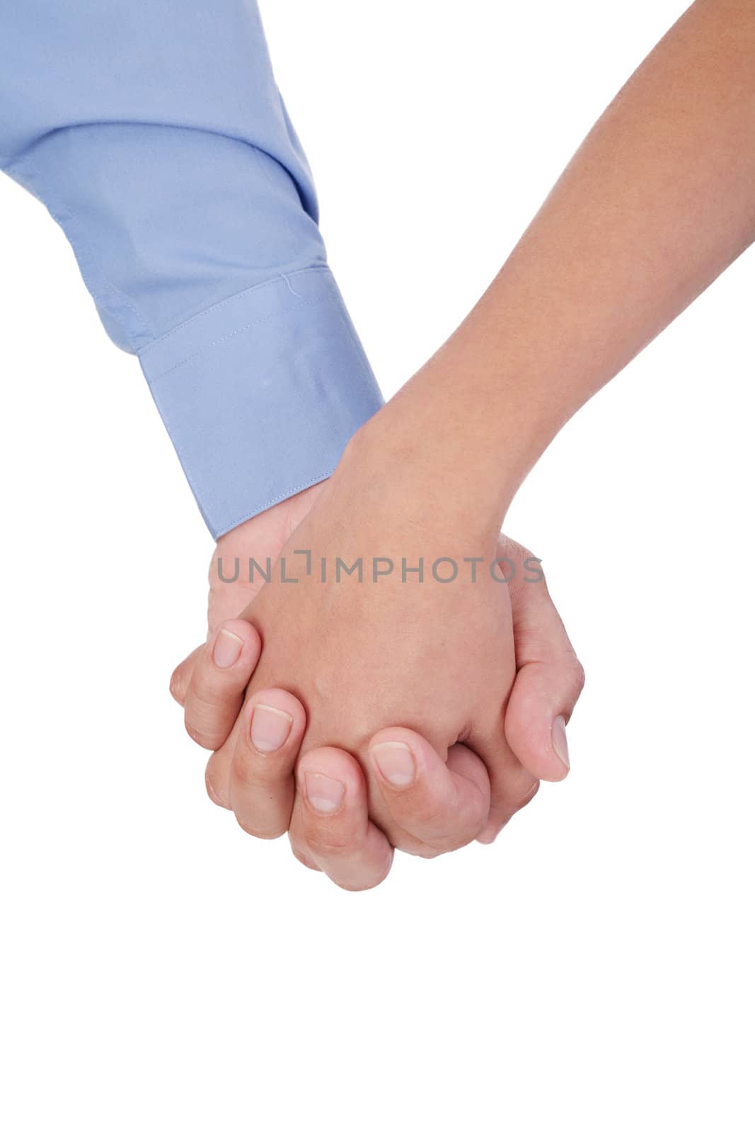Closeup of young affectionate couple holding hands over white ba by dacasdo