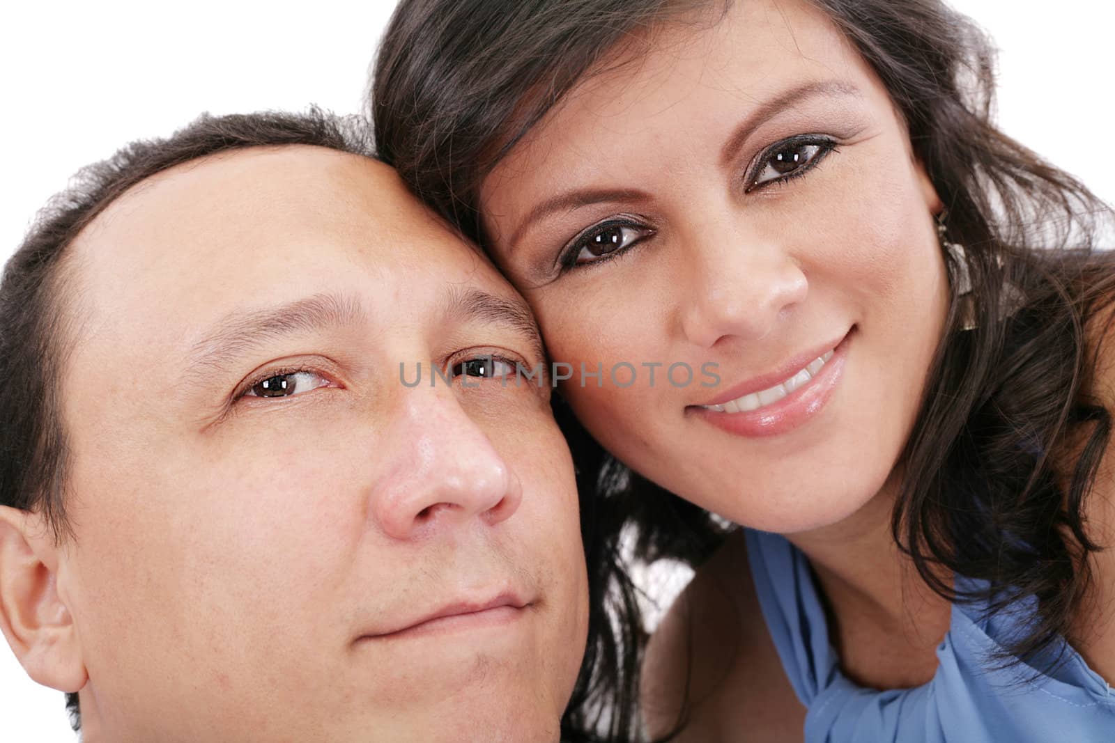 Closeup portrait of a sweet young couple smiling together by dacasdo