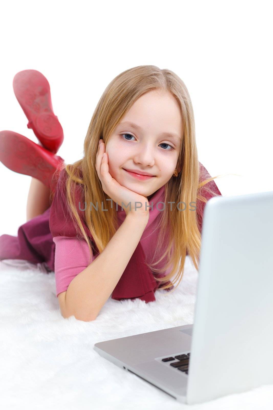 Attractive young girl using notebook computer. Isolated on white background.