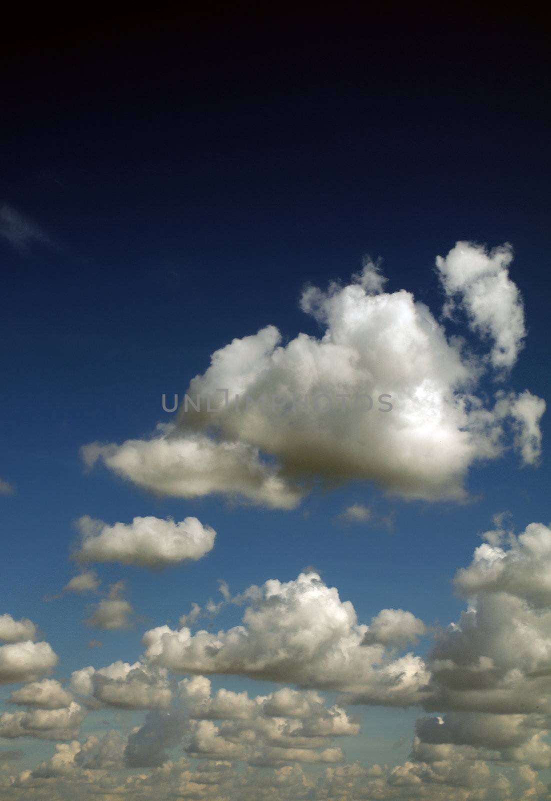 Clouds on Sunny Summer Blue Sky in a Row