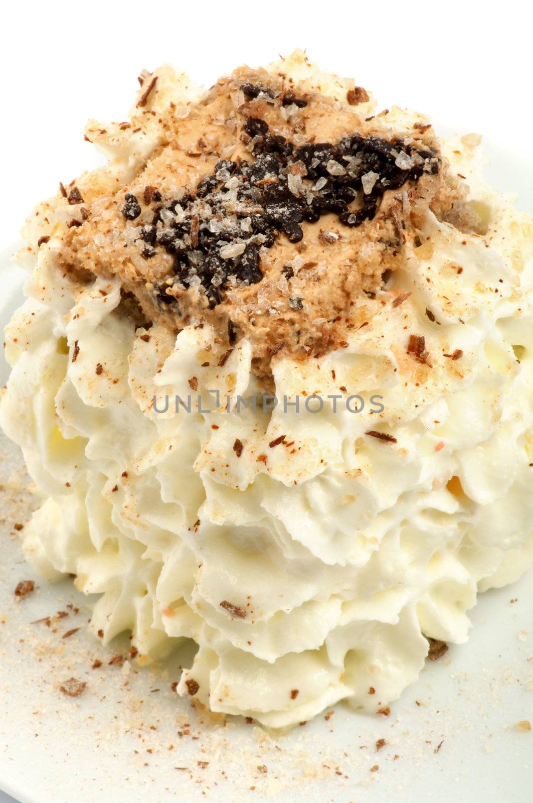 Delicious Cream Cake with Chocolate Sprinkles closeup 