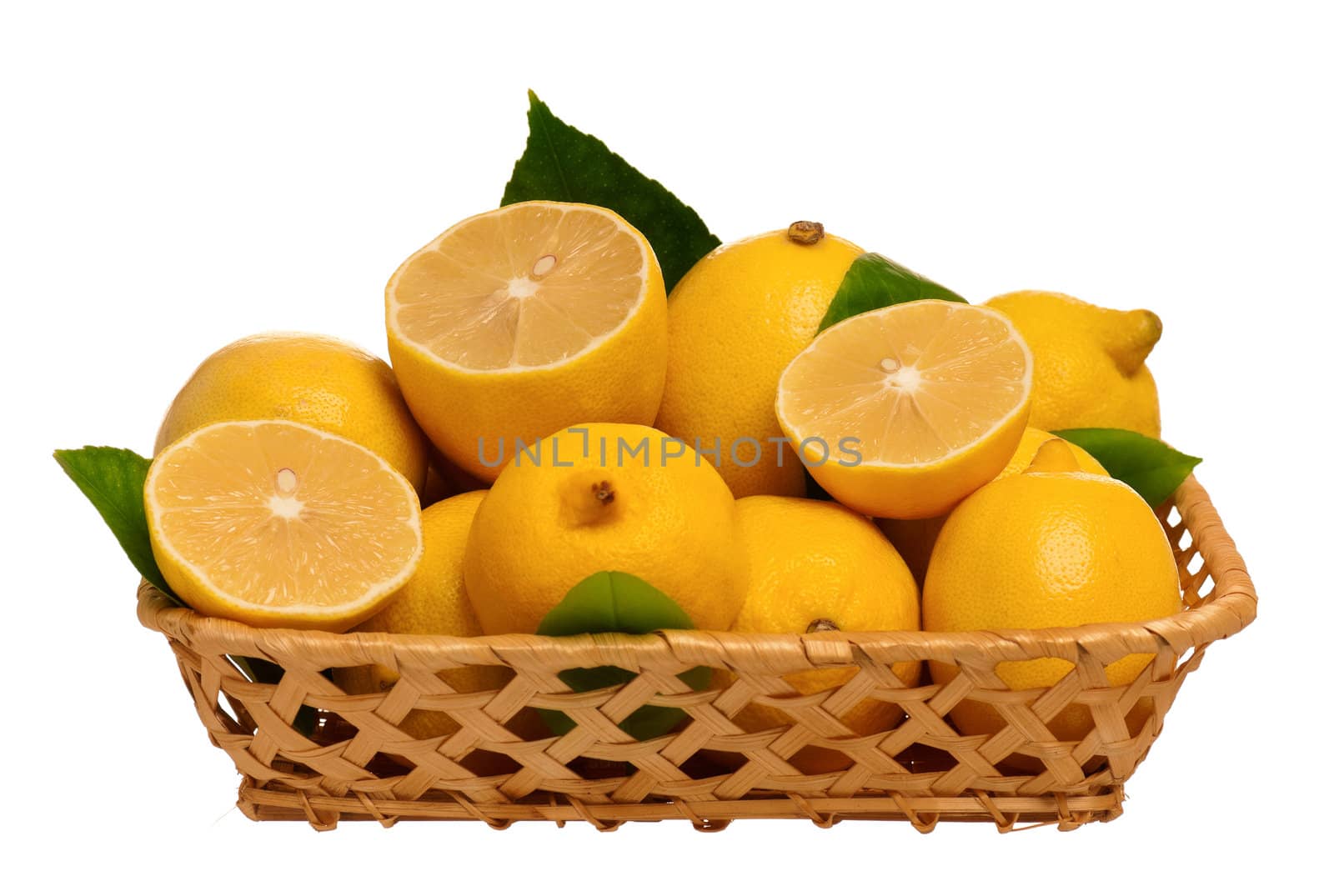 Fresh ripe lemons in wicker basket isolated on white background