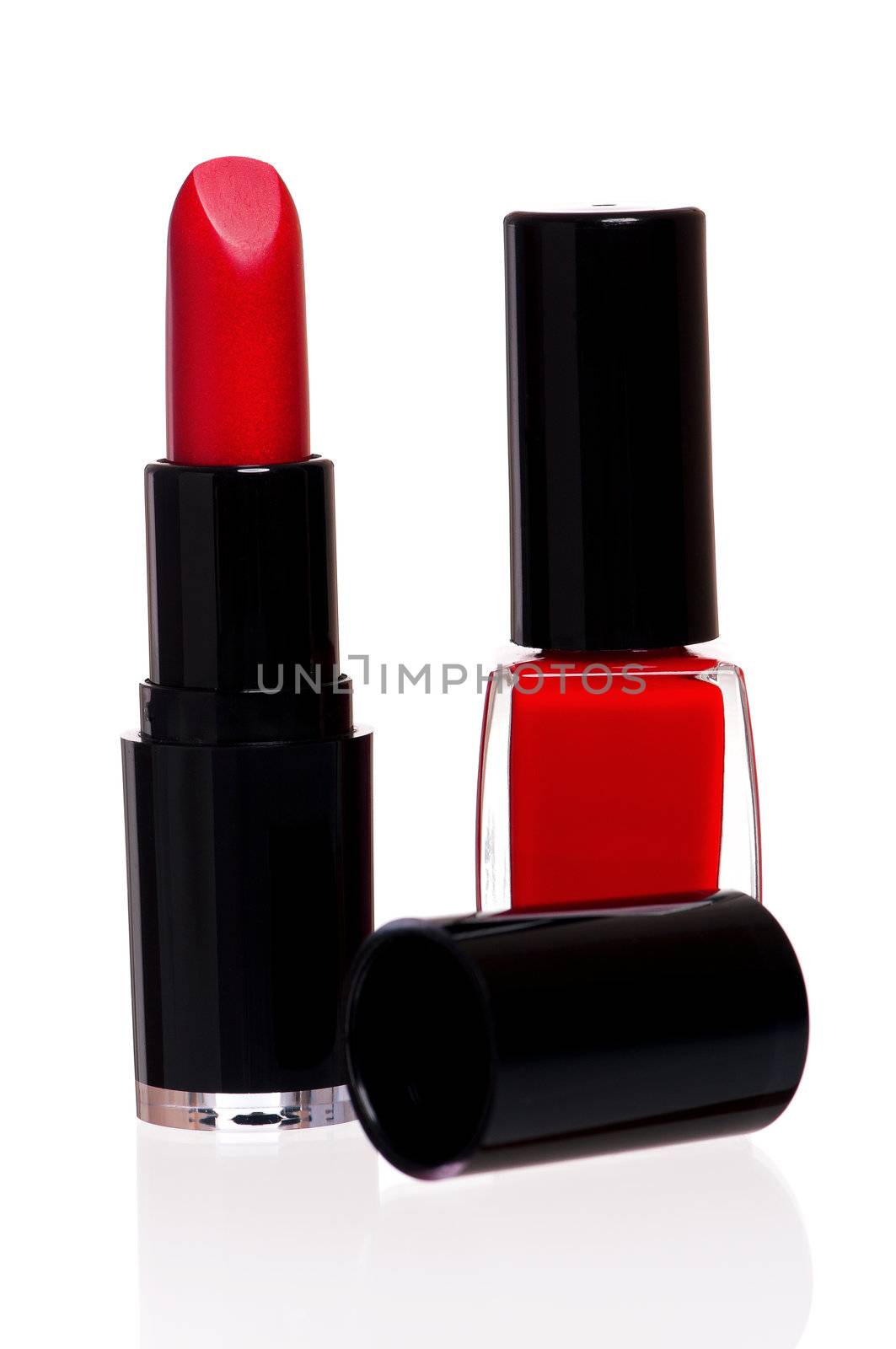 Red lipstick and nail polish isolated on white background