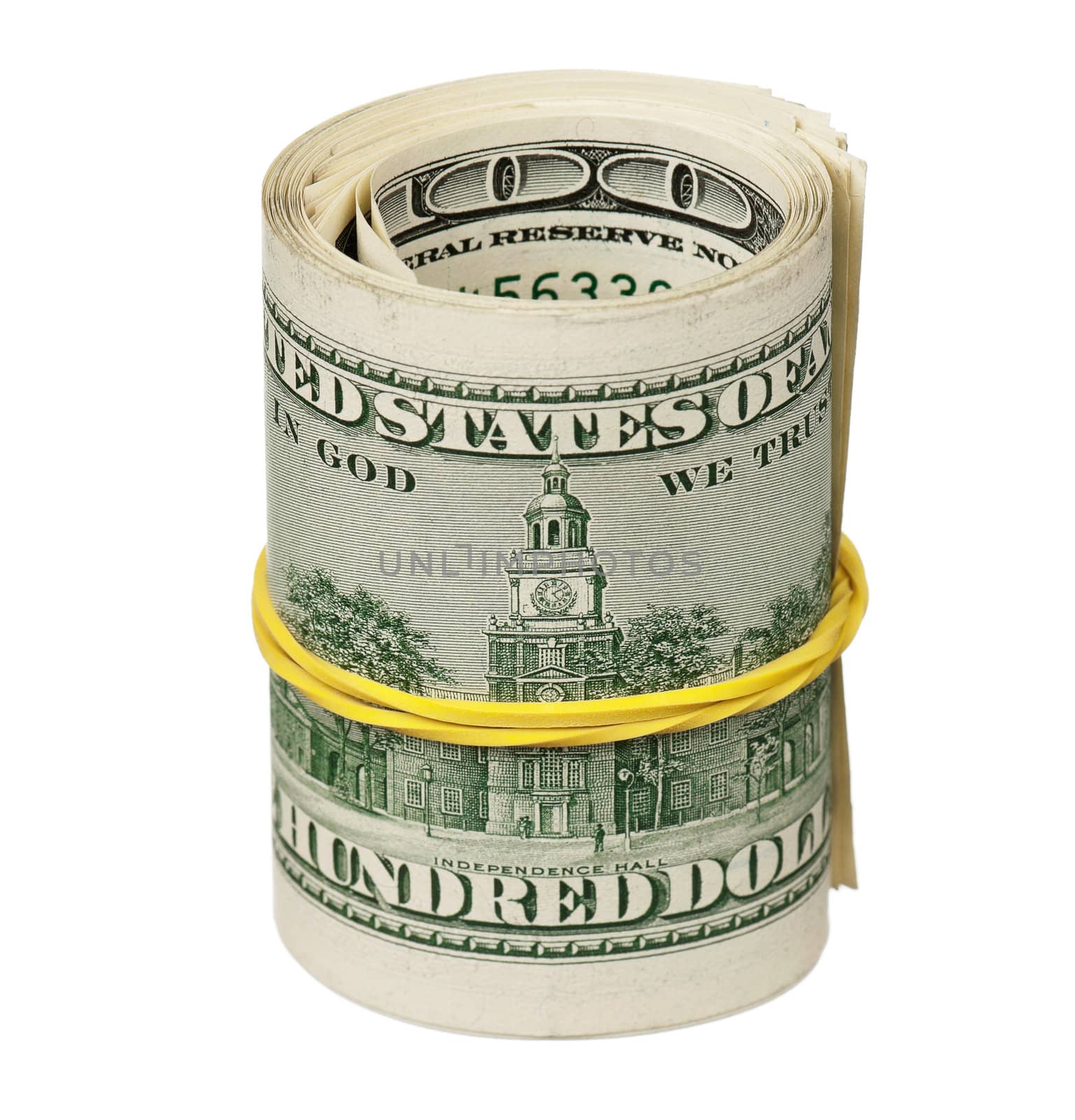 Roll of dollars with rubber band isolated on white background