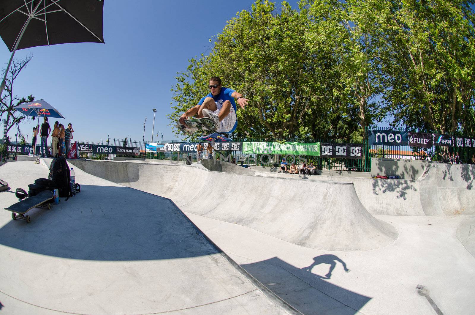 VISEU, PORTUGAL - JULY 22: Joao Sa grab during pool trainings at DC Skate challenge by MEO on july 22, 2012 in Viseu, Portugal.