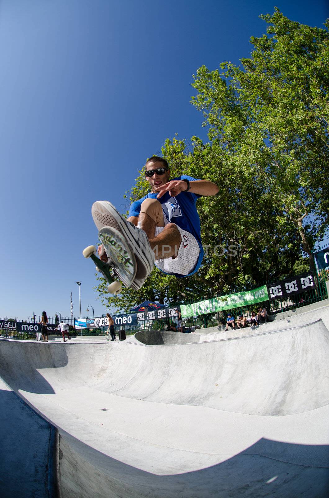 VISEU, PORTUGAL - JULY 22: Joao Sa grab during pool trainings at DC Skate challenge by MEO on july 22, 2012 in Viseu, Portugal.