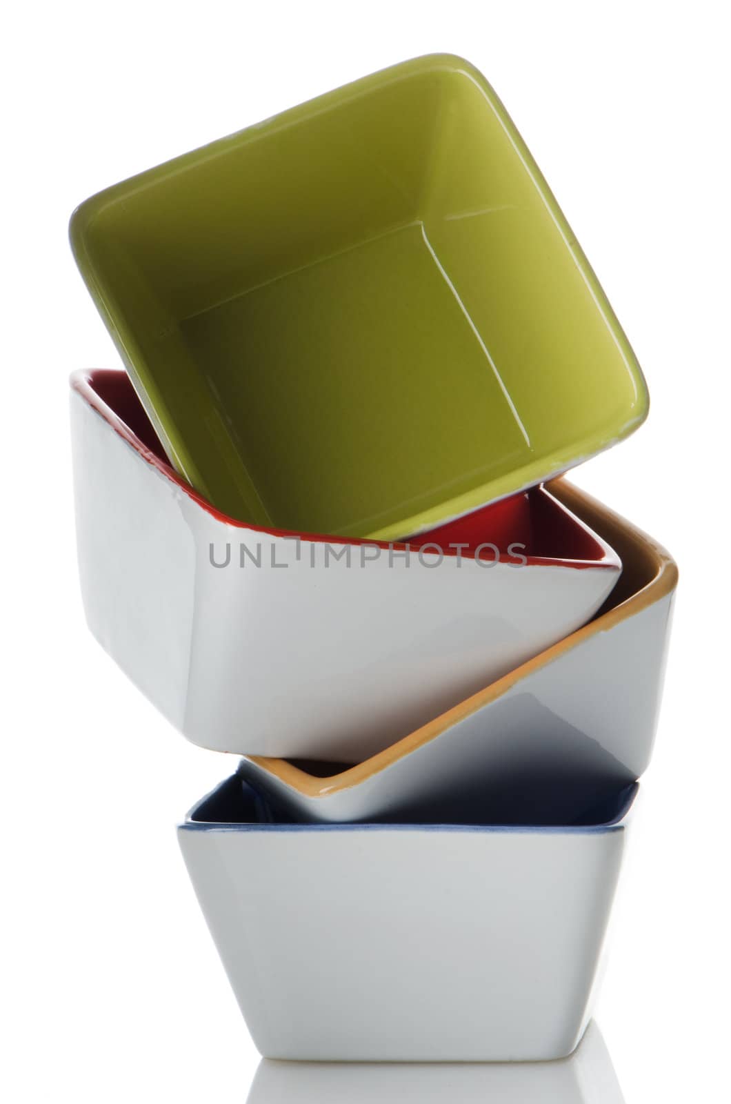 Colorful bowls stacked one above the other on white background.
