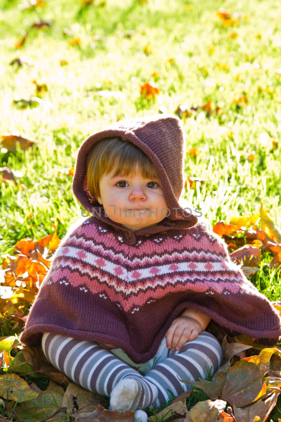 baby with autumn leaf