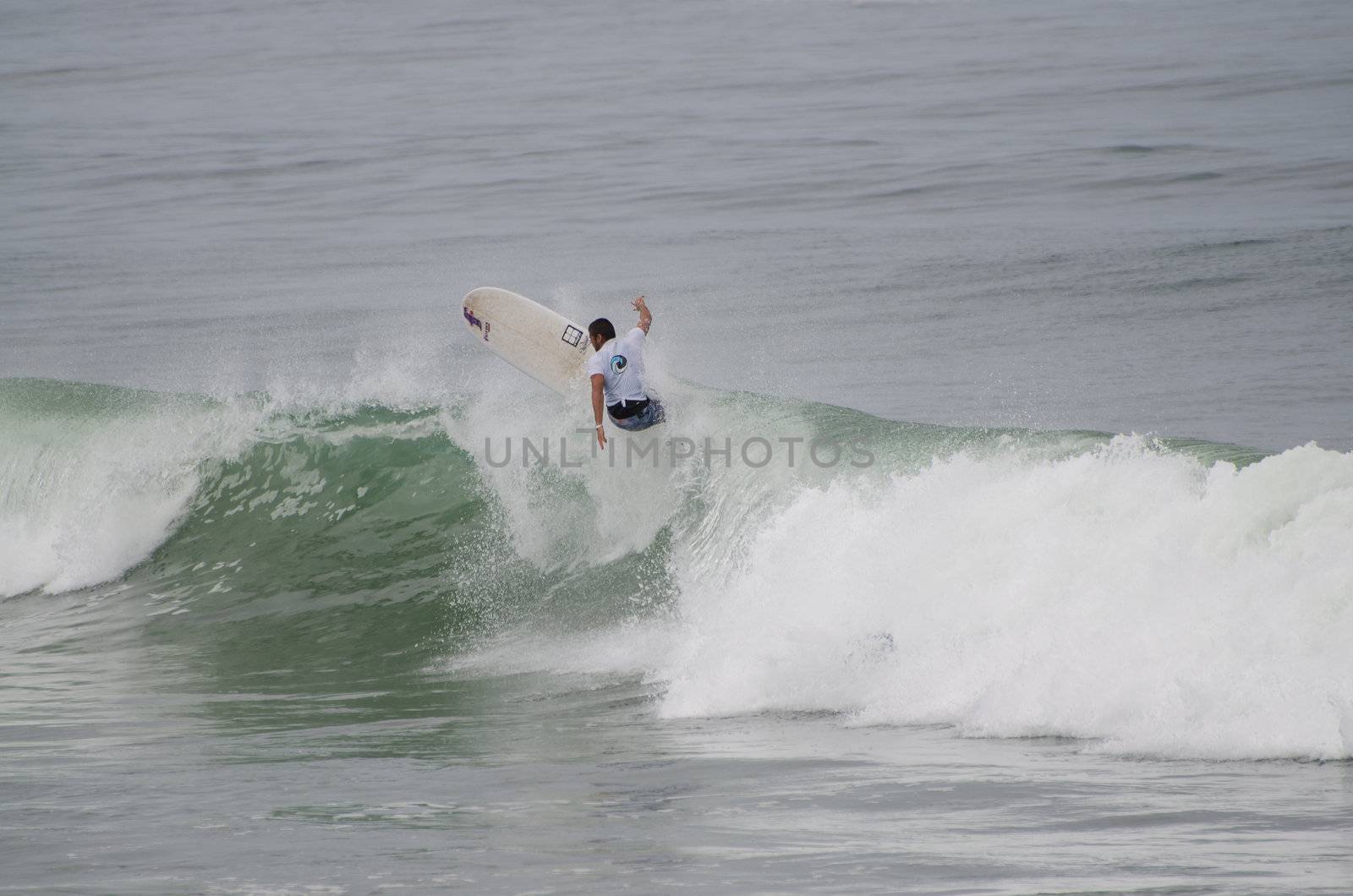 OVAR, PORTUGAL - AUGUST 19: Unidentified surfer at 1st stage of National Longboard Championship  on august 19, 2012 in Ovar, Portugal.