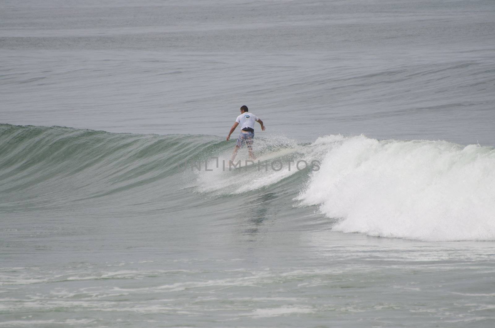 OVAR, PORTUGAL - AUGUST 19: Unidentified surfer at 1st stage of National Longboard Championship  on august 19, 2012 in Ovar, Portugal.