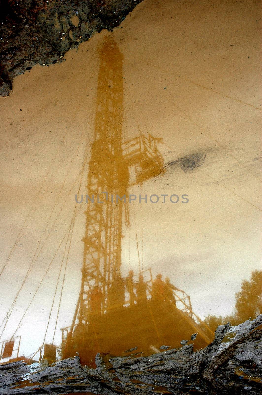 reflection of petroleum miners in the mining area