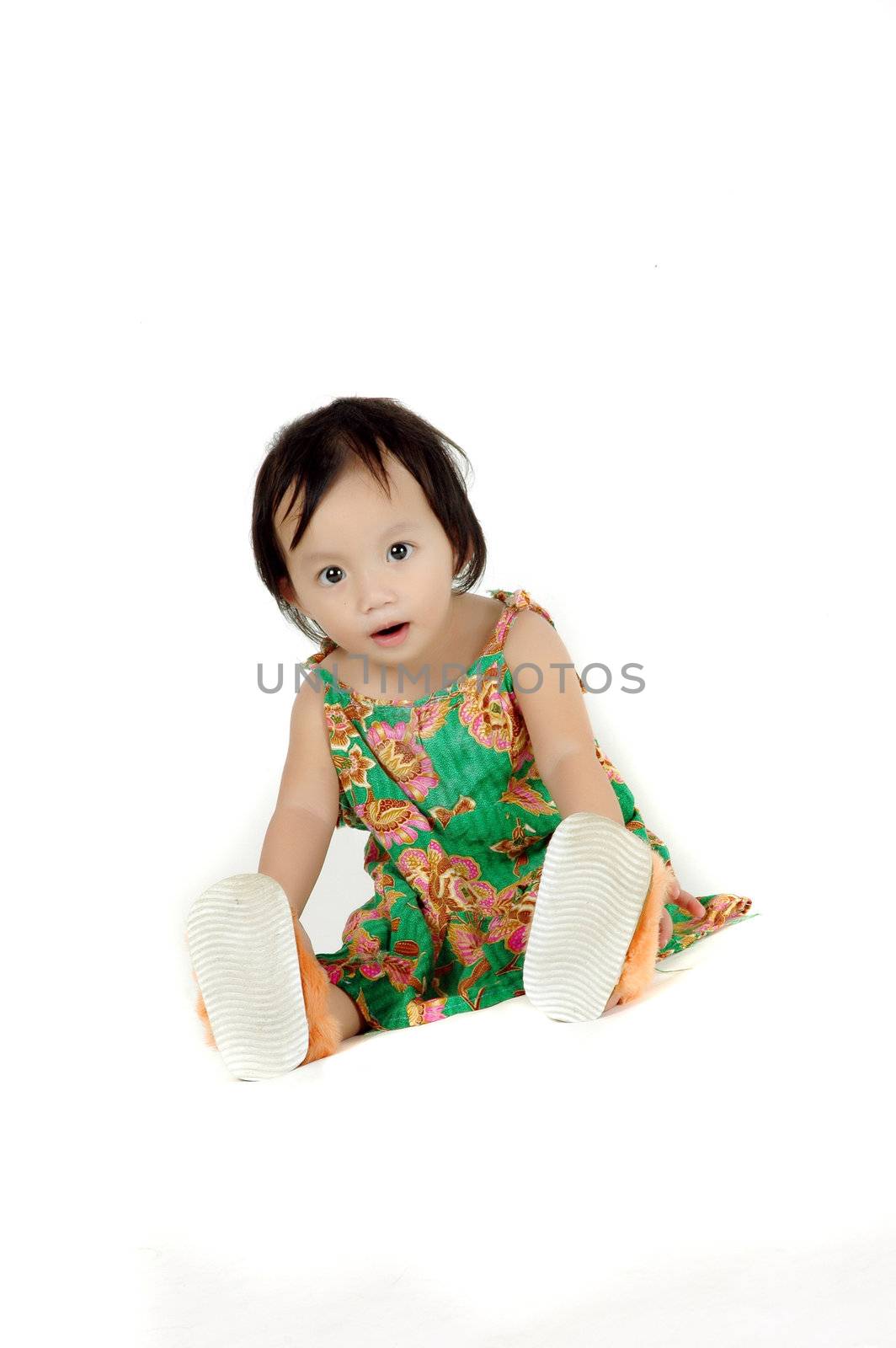 asia little girl on a white background in the photo studio