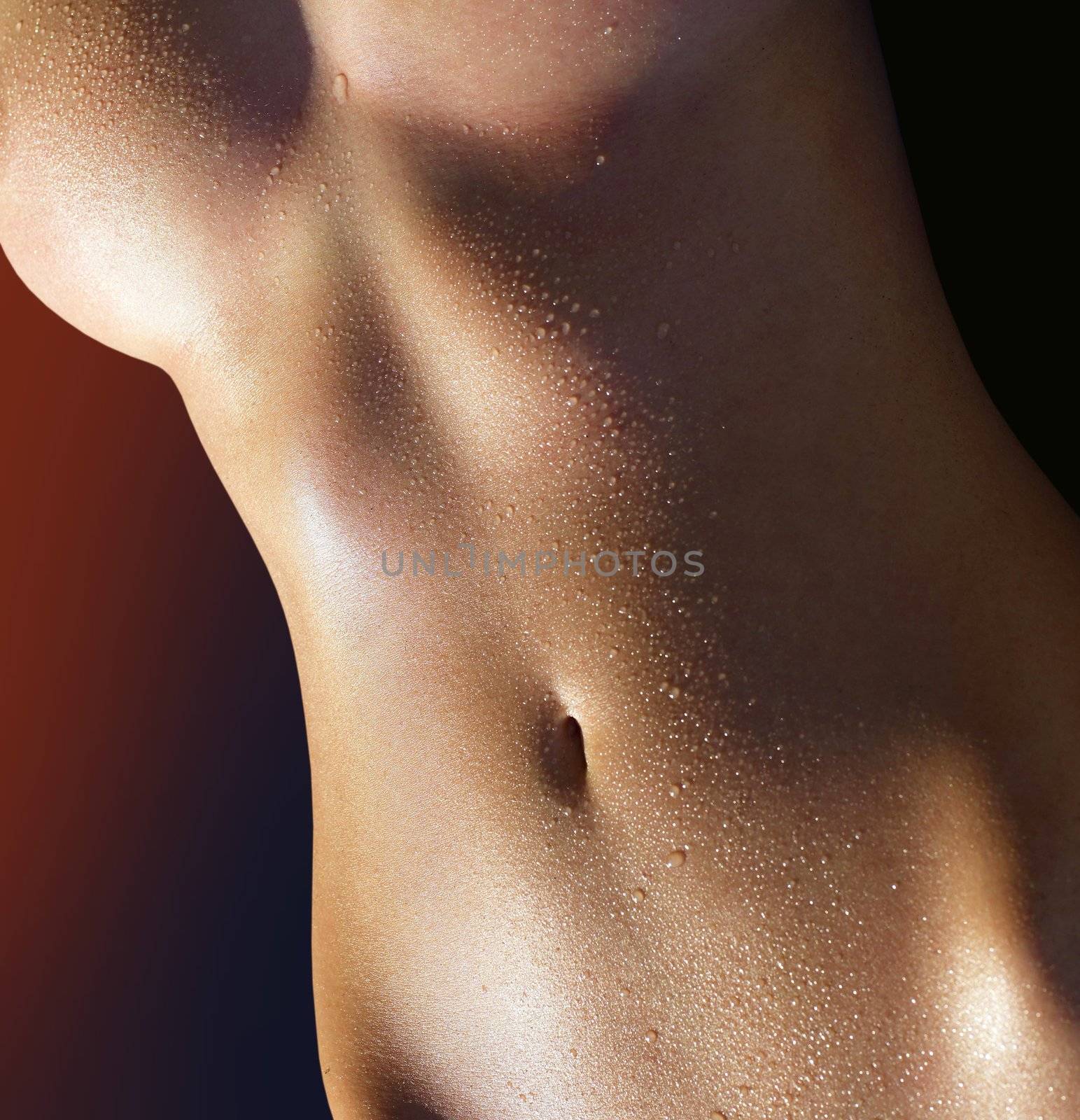 body of the woman covered with water droplets