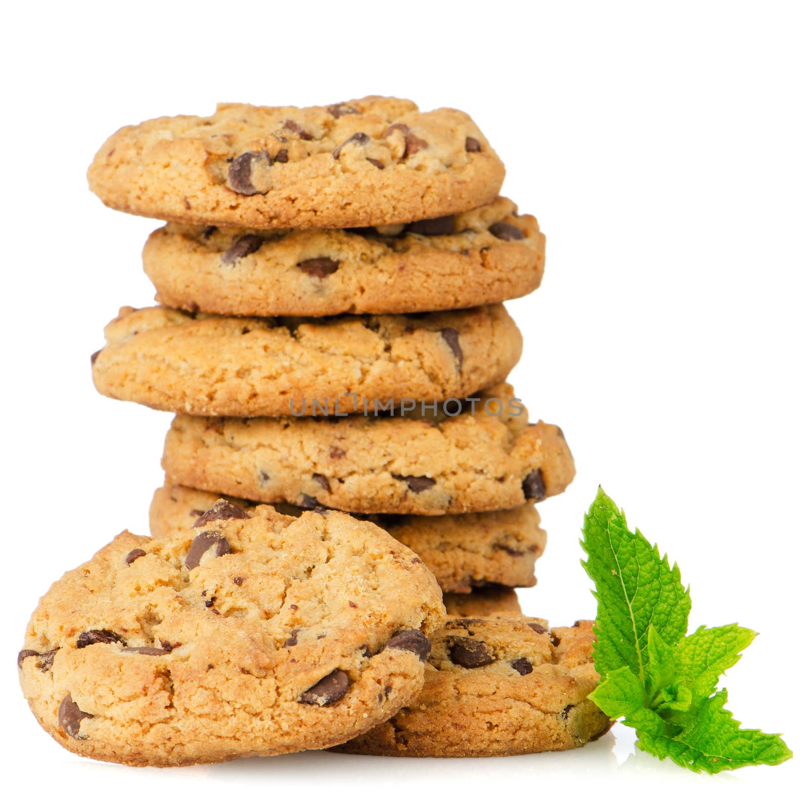 Chocolate cookies with mint leaves isolated on white background.