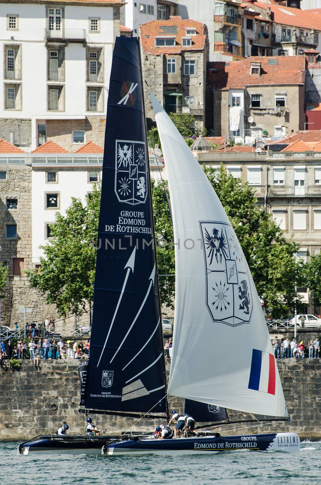 PORTO, PORTUGAL - JULY 07: Groupe Edmond de Rothschild compete in the Extreme Sailing Series boat race on july 07, 2012 in Porto, Portugal.